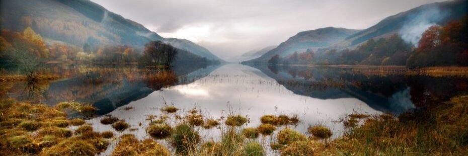 still-area-water-with-reflection-of-background-hills