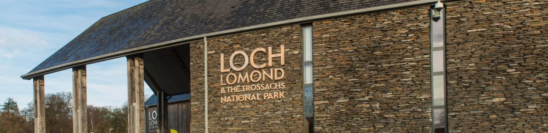 loch-lomond-and-the-trossachs-national-park-authority-headquarters-building-with-logo-large-and-prominent-above-main-entrance