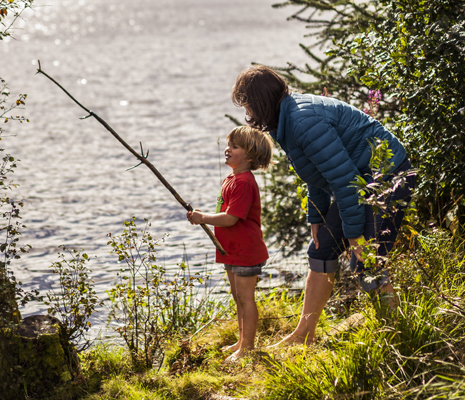 mother-and-child-at-edge-of-loch-drunkie-both-barefoot-boy-is-holding-a-long-stick-mock-fishing-rod