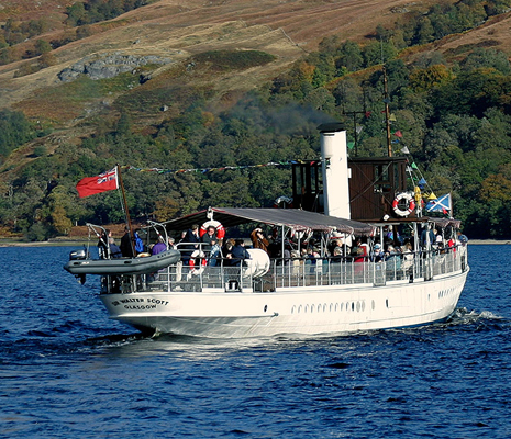 steamship-packed-with-people-crossing-waters-of-loch-katrine-in-summer