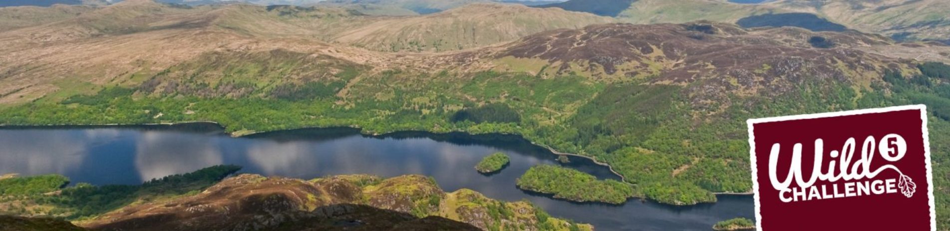 loch-katrine-and-trossachs-hills-panorama-text-in-corner-reading-wild-challenge-five