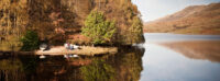 boats-on-beach-at-lochside