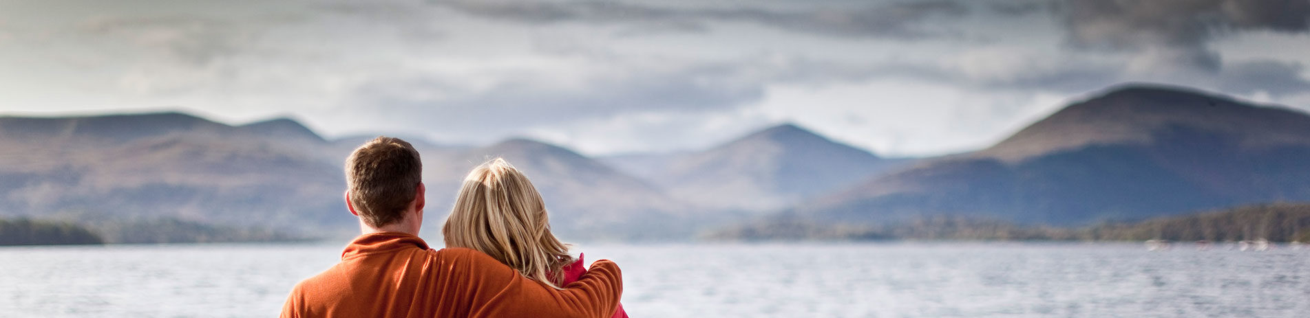 two-people-admiring-the loch-hills