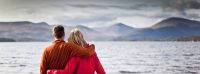 two-people-admiring-the loch-hills