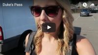 girl-with-backpack-standing-in-car-park