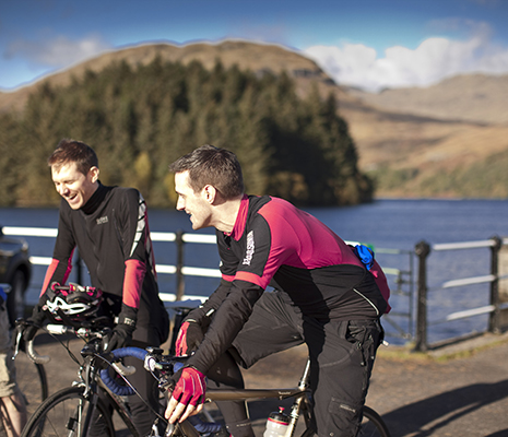 two-men-on-bikes-laughing