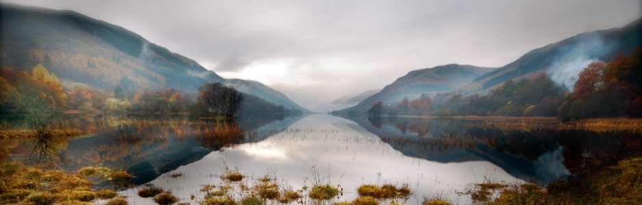 still-area-water-with-reflection-of-background-hills