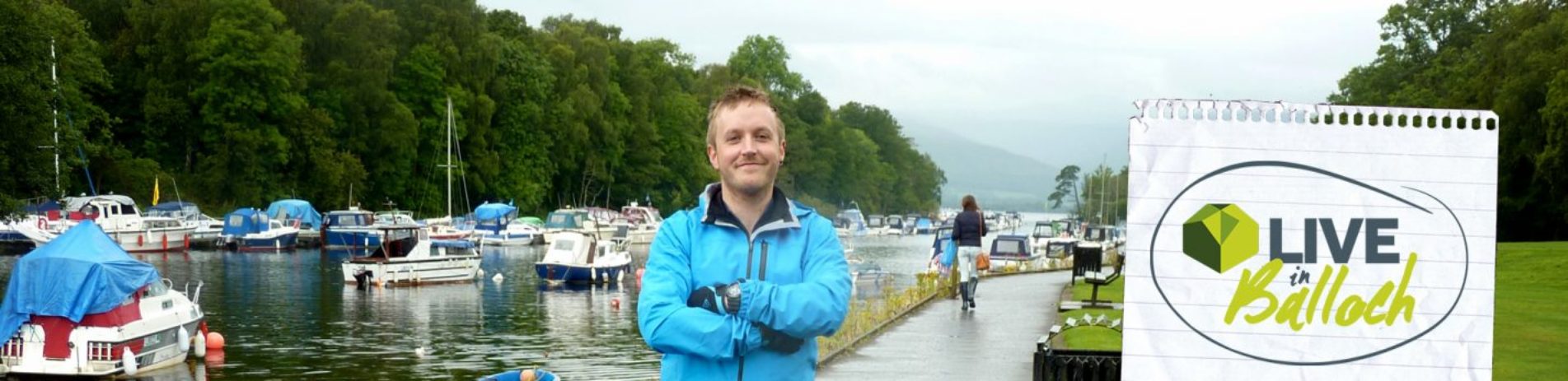 live-in-balloch-man-standing-in-front-of-moored-boats