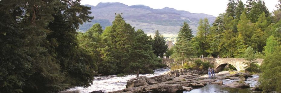 fast-flowing-water-at-falls-of-dochart-stone-bridge