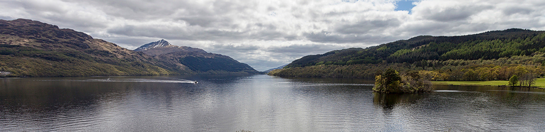 landscape-of-loch-lomond-wooded-shores-with-ben-lomond-prominent-in-the-distance-on-the-left