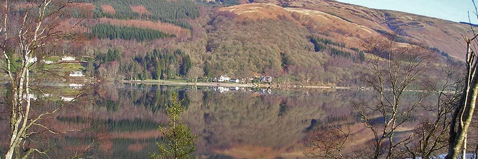 loch-ard-mirror-like-surface-with-surrounding-forest-in-late-autumn-colours