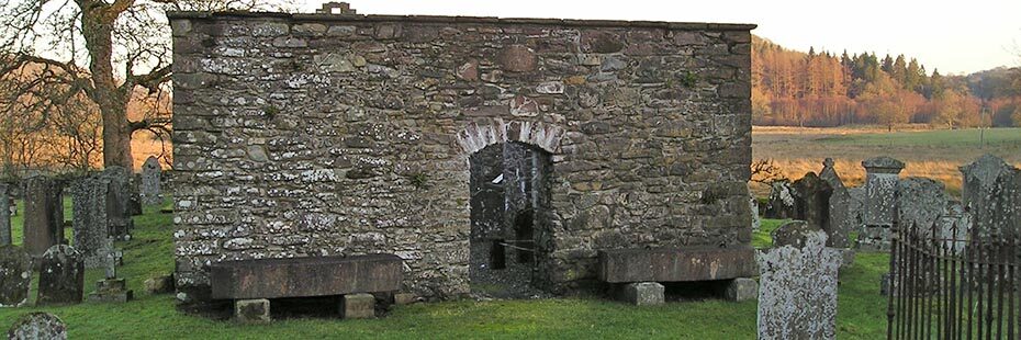 church-ruin-among-ancient-graveyard-stone-and-late-autumn-colours-behind