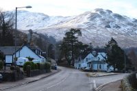 village-with-snow-covered-mountains