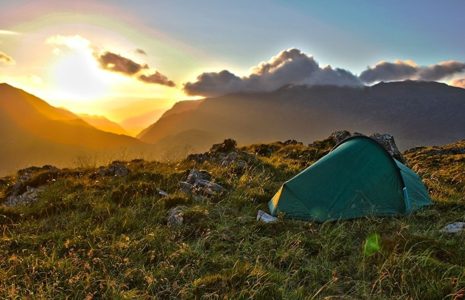 tent-and-mountains-at-sunset