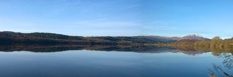 panoramic-loch-forest-blue-sky-and-mountains