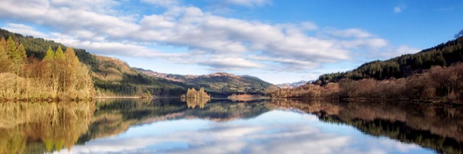 panoramic-loch-forest-and-blue-sky