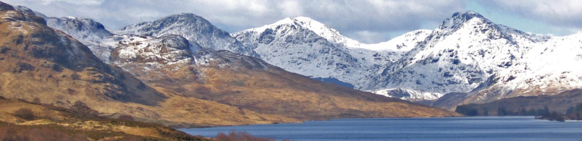 panoramic-loch-and-snow-covered-mountains