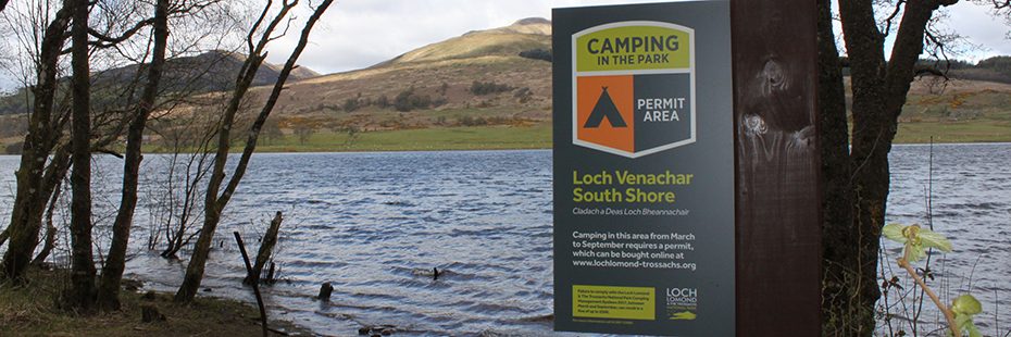 camping-in-the-park-permit-area-loch-venachar-south-shore-metal-sign-at-edge-of-water