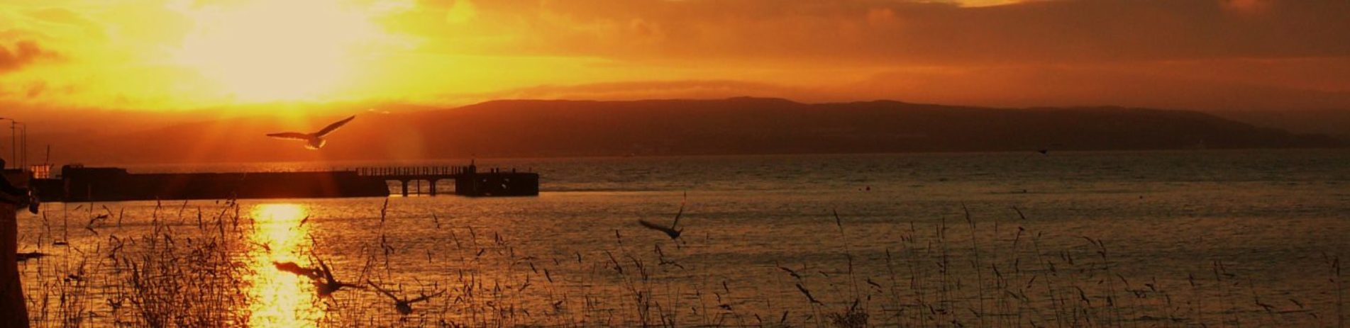 sunrise-over-loch-pier-and-mountains