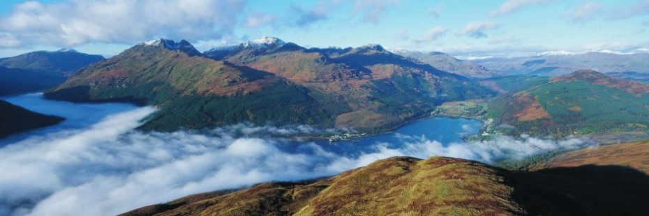 aerial-view-of-loch-and-mountains-on-partly-cloudy-day