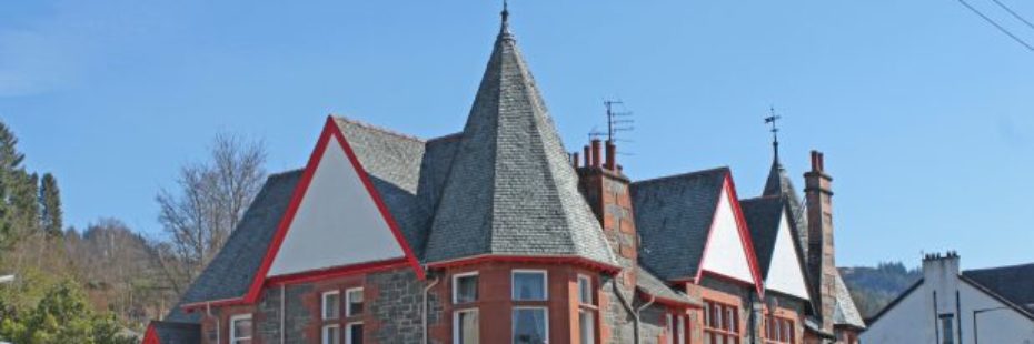 red-sand-stone-building-with-shops