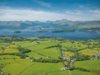 view-of-gartocharn-village-and-lush-farmland-with-loch-lomond-and-its-islands-and-surrounding-hills-seen-from-duncryne-hill