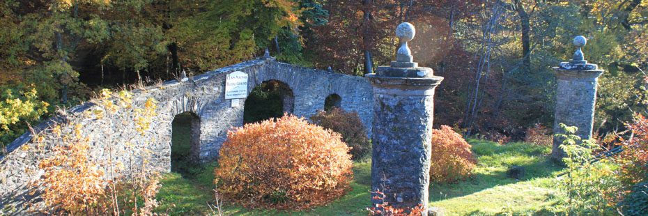 killin-village-old-burial-ground-entrance-arched-stone-gate-with-forest-behind