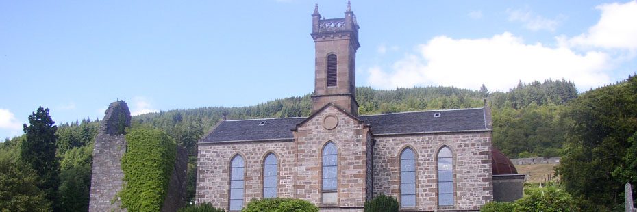 kilmun-church-with-woods-on-hill-visible-behind-and-old-medieval-tower-covered-in-ivy-on-its-left