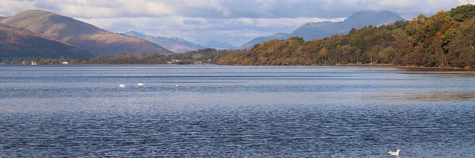 panorama-of-loch-lomond-surrounding-hills-and-forests-and-ben-lomond-in-the-disdtance-autumn-colours