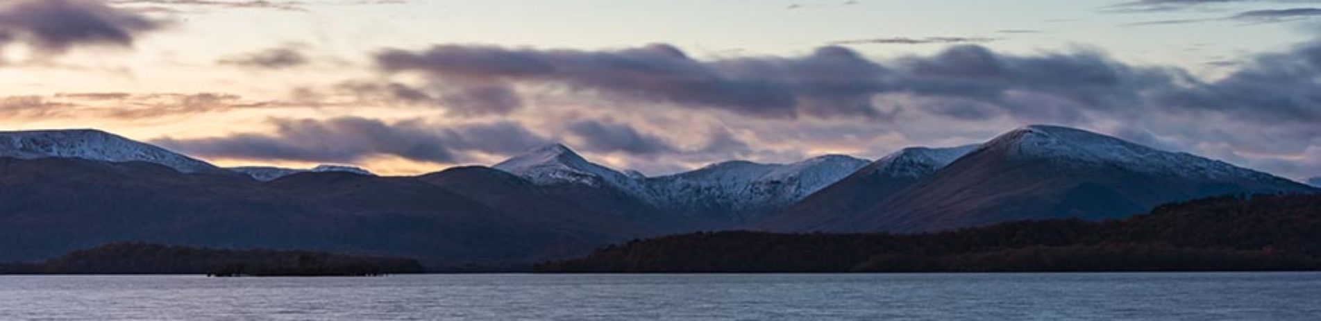 luss-hills-covered-with-a-smattering-of-snow-above-loch-lomond-and-dusk