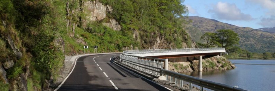 road-steep-hillside-and-water-either-side