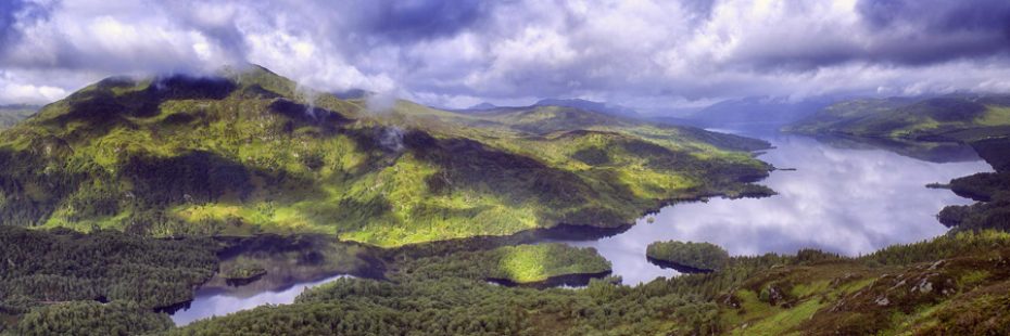 stunning-view-of-loch-katrine-and-and-ben-venue-with-clouds-low-and-light-filtering-through-them-from-summit-of-ben-aan