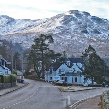 arrochar-village-view-in-winter-with-surrounding-hills-covered-in-a-smatter-of-snow