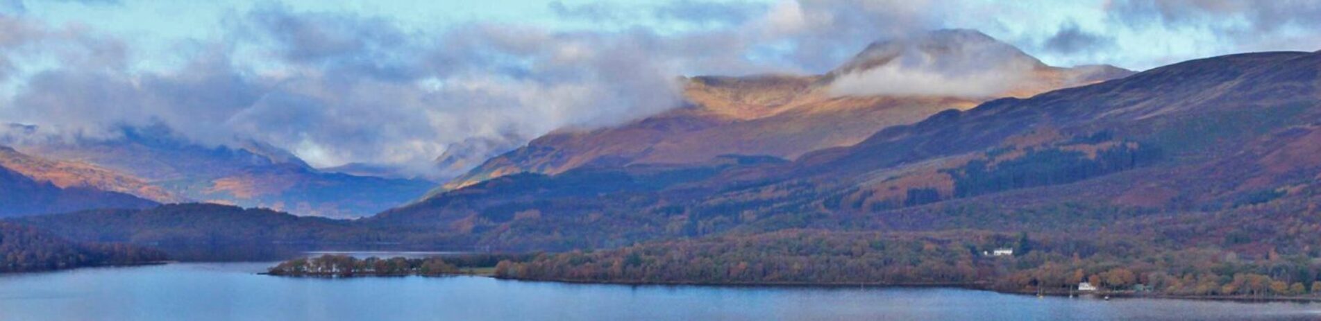 panorama-of-loch-lomond-with-ben-lomond-partly-covered-by-clouds-towering-on-the-right