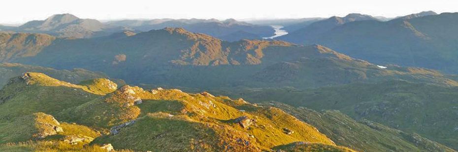 sunset-light-covering-flanks-of-beinn-chabhair-with-stunning-mountain-scenery-around-and-loch-long-in-the-very-distance