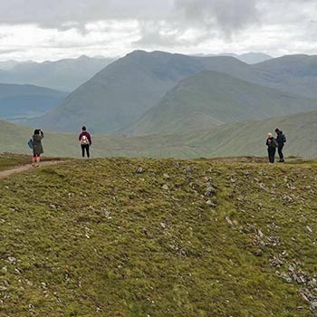 ben-challum-slopes-four-walkers-admiring-views-and-photographing-them