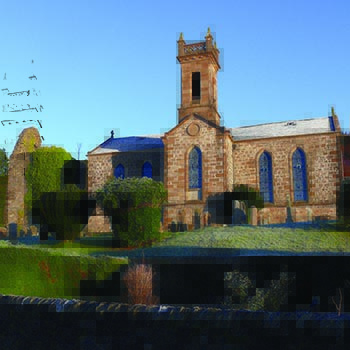 kilmun-victorian-church-with-light-smattering-of-snow-on-roof-and-grass-lawn-blue-skies-above