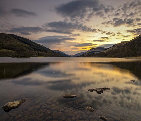 loch-voil-view-at-sunset-with-clear-mirror-surface-and-hills-on-both-sides