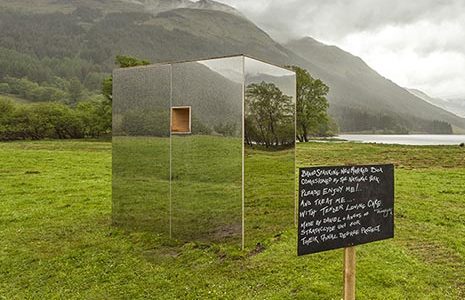 lookout-mirror-cabin-in-middle-of-fields-with-loch-doine-behind-and-high-breadalbane-hills-low-clouds
