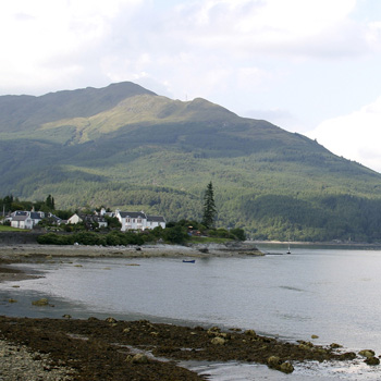 ardentinny-village-on-shore-of-loch-long-with-forested-high-hill-above