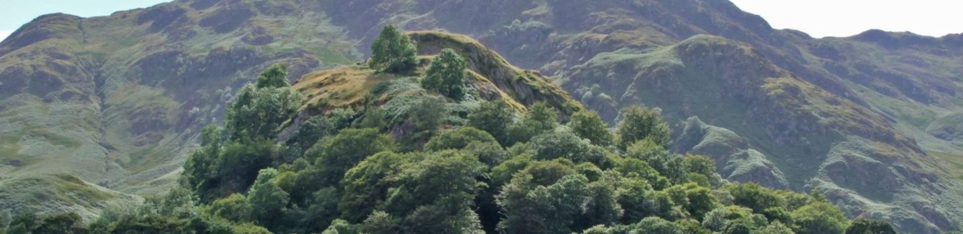 dundurn-hill-covered-by-trees-against-larger-hills-background-in-saint-fillans-village