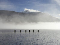 tarbet-pier-view-of-loch-lomond-and-ben-lomond-partly-covered-by-mist-through-sunshine