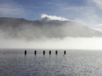 tarbet-pier-view-of-loch-lomond-and-ben-lomond-partly-covered-by-mist-through-sunshine
