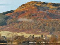sron-a-chlachain-hill-in-autumn-colours-above-killin-village-seen-from-loch-tay-shore