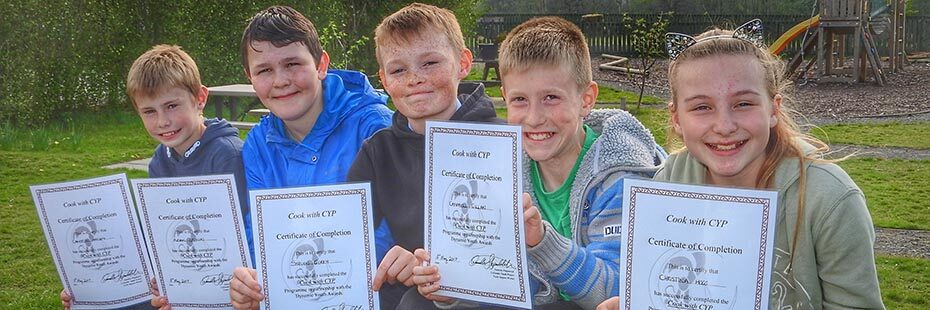 callander-youth-project-young-participants-holding-certificates-with-beaming-faces