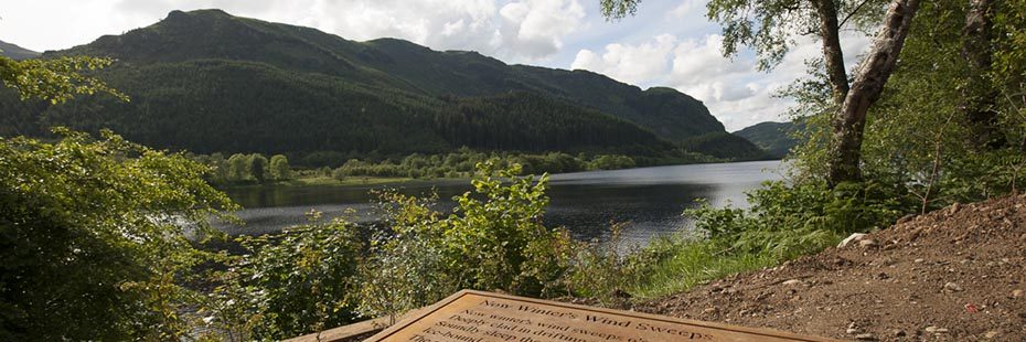 art-installation-on-shores-of-loch-lubnaig-forested-hills-across-the-water