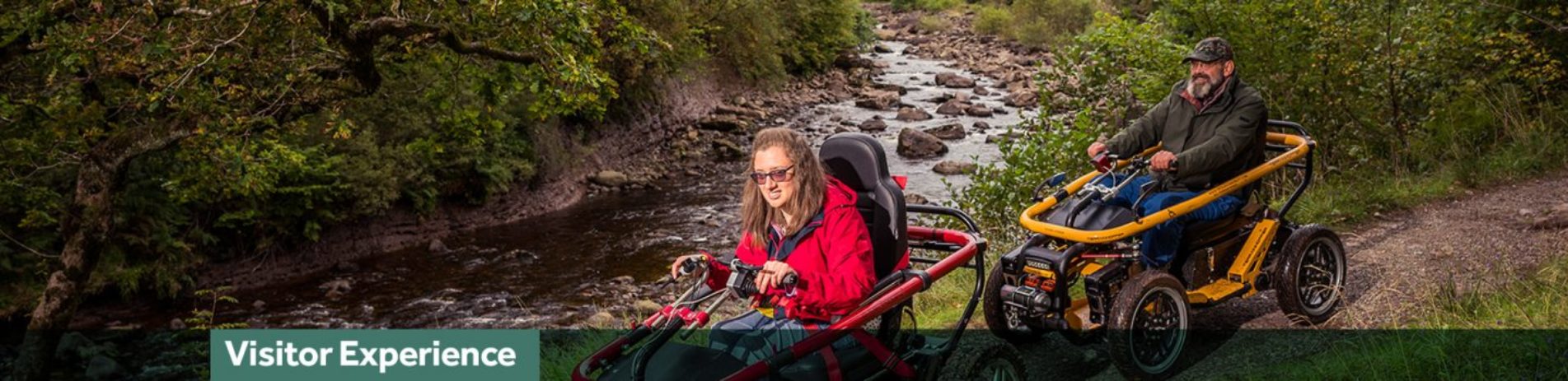 woman-and-man-on-mobility-scooters-on-path-next-to-river-lush-vegetation-around-banner-with-words-reading-visitor-experience-on-bottom-of-image