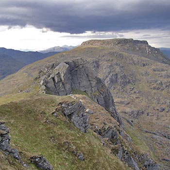 beinn-narnain-summit-seen-from-cobbler-dark-clouds-on-sky