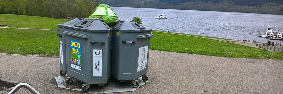 waste-bins-at-tarbet-car-park-with-loch-lomond-and-boats-visible-on-the-right