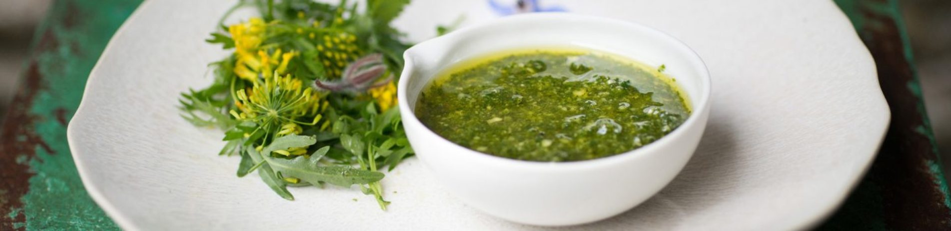 light-green-nettle-pesto-in-white-bowl-on-table